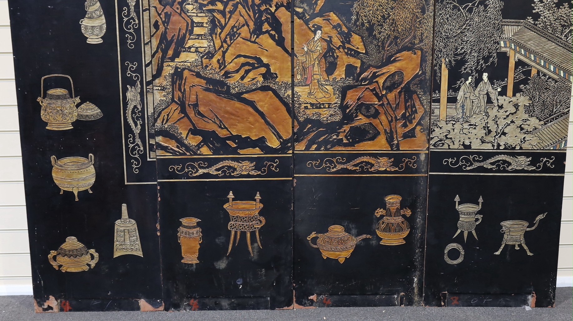 A tall Chinese coromandel lacquer twelve panel screen, 19th century, each leaf panel width 49cm, height 264cm